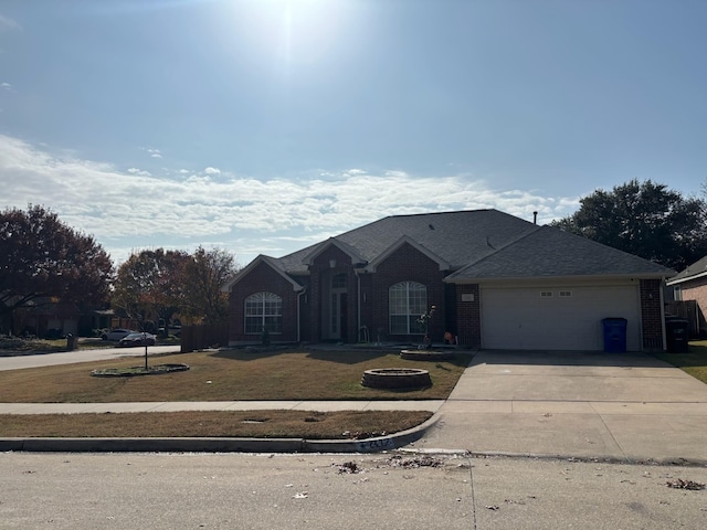 view of front facade with a front lawn and a garage