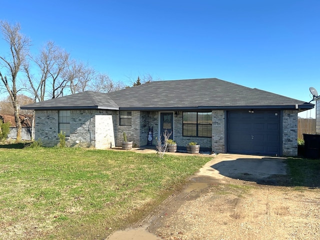 view of front of property featuring a garage and a front yard