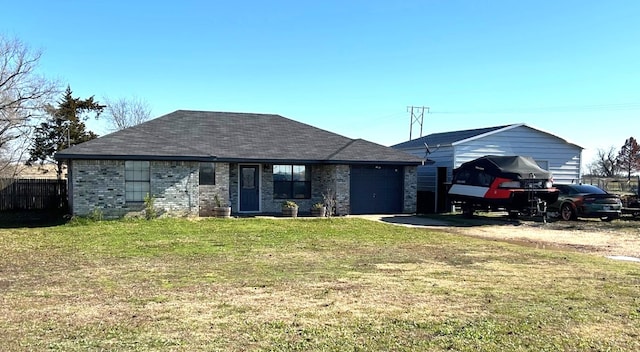 view of front of property with a garage and a front lawn