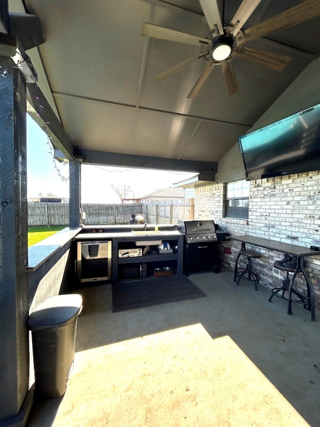 view of patio with a grill and an outdoor bar