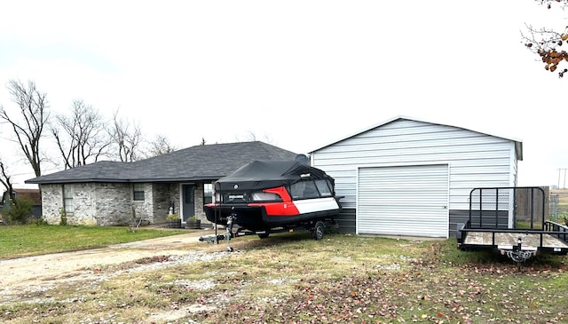 exterior space featuring a garage and a lawn