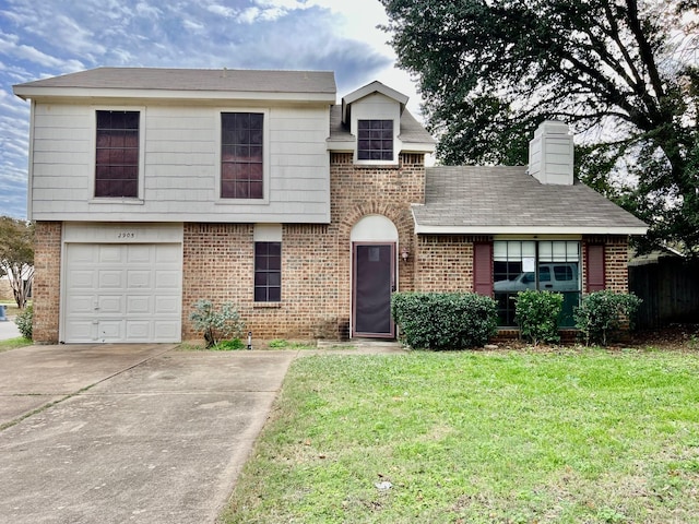 view of front of home with a front lawn and a garage