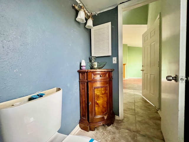 bathroom featuring tile patterned floors and sink