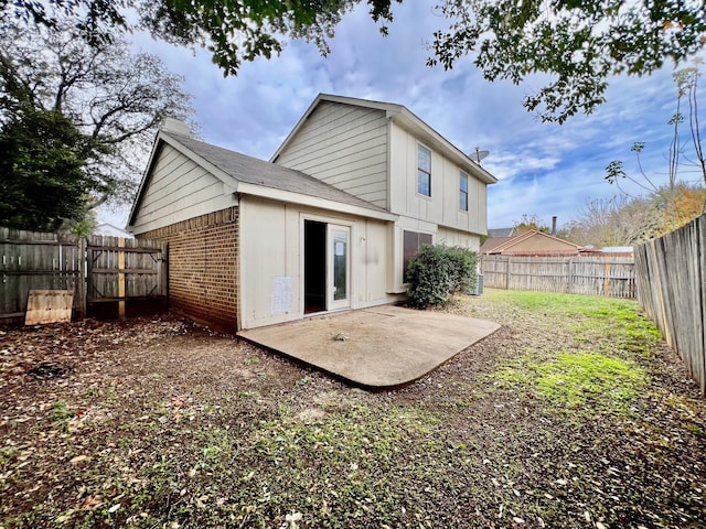 back of house with a patio