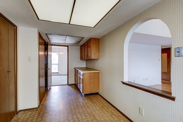 kitchen featuring a chandelier