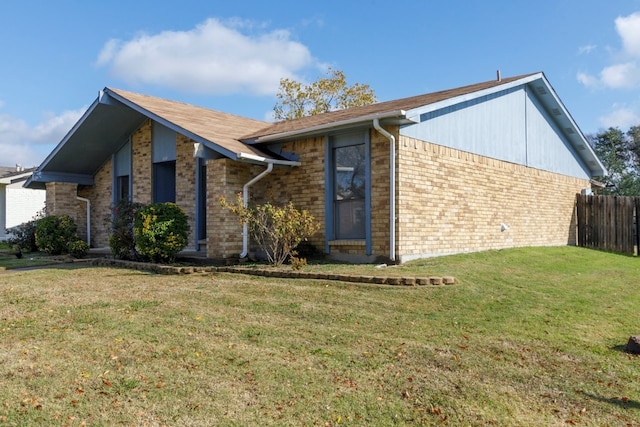 view of home's exterior featuring a lawn