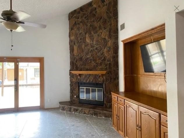 kitchen featuring a skylight, a kitchen island, a textured ceiling, and independent washer and dryer