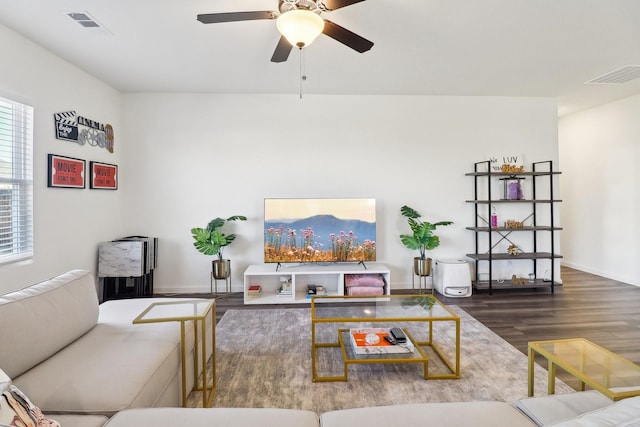 living room featuring ceiling fan and hardwood / wood-style floors