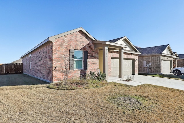 view of front of home with a front yard and a garage