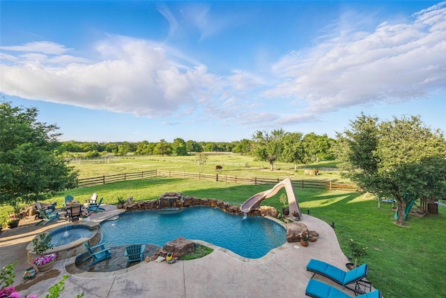 12201 Madison Ln, Justin, TX 76247 - view of swimming pool featuring a fire pit, a water slide, a patio, a rural view, and a pool with connected hot tub