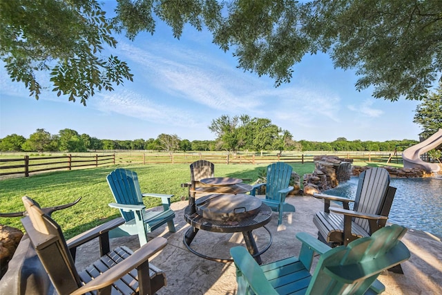 12201 Madison Ln, Justin, TX 76247 - view of patio / terrace featuring a fire pit and a rural view