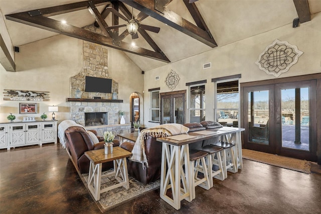 12201 Madison Ln, Justin, TX 76247 - living area featuring high vaulted ceiling, beam ceiling, finished concrete floors, a ceiling fan, and french doors