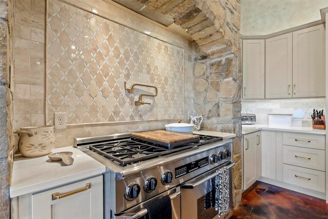 12201 Madison Ln, Justin, TX 76247 - kitchen featuring double oven range, light countertops, decorative backsplash, and concrete flooring