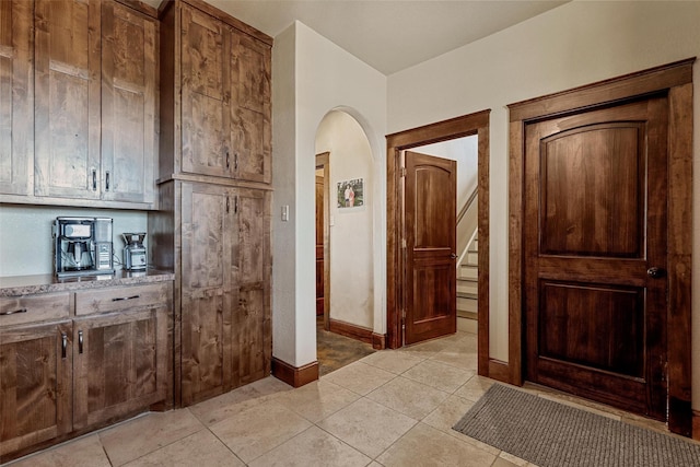 interior space featuring light tile patterned floors