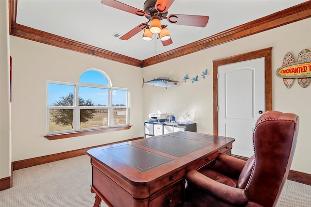 carpeted home office with crown molding and ceiling fan