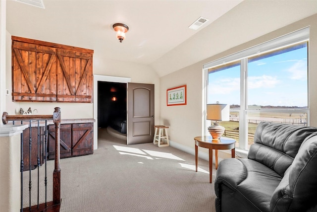 sitting room with vaulted ceiling and carpet