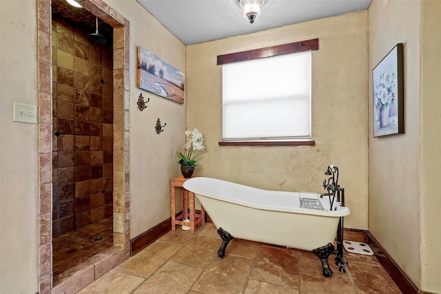 12201 Madison Ln, Justin, TX 76247 - bathroom featuring a tile shower, a freestanding bath, and baseboards