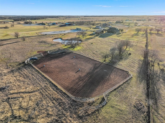 birds eye view of property with a rural view