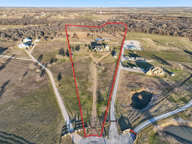 birds eye view of property featuring a rural view