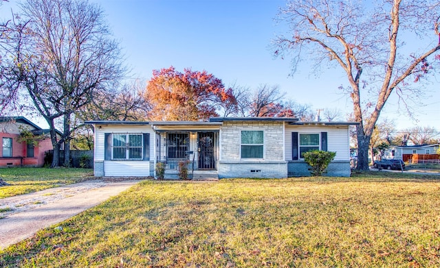 ranch-style house with a front lawn