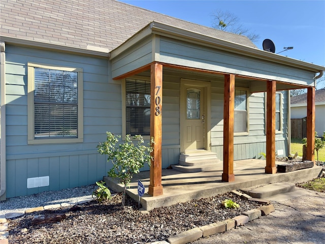 entrance to property with covered porch