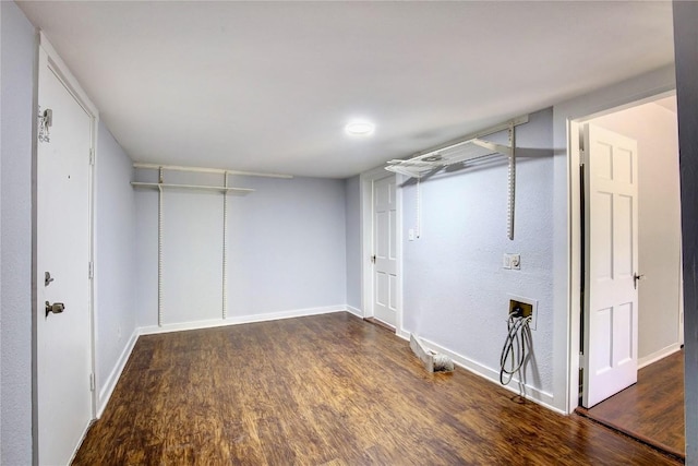 basement with dark hardwood / wood-style flooring