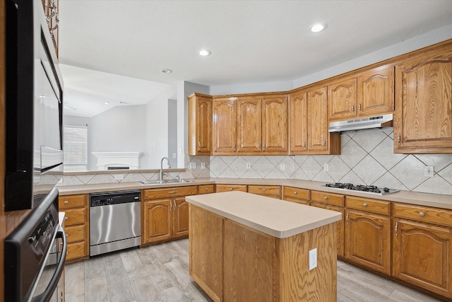 kitchen with sink, a center island, stainless steel dishwasher, light wood-type flooring, and white gas cooktop