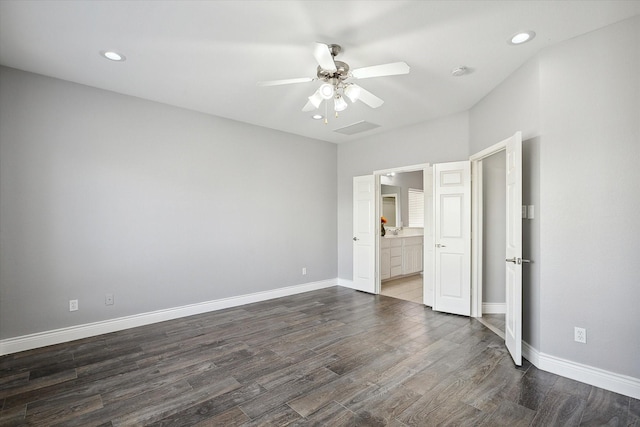 unfurnished bedroom with ceiling fan, dark hardwood / wood-style floors, and ensuite bath