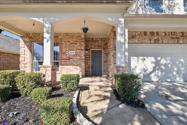 doorway to property featuring a garage