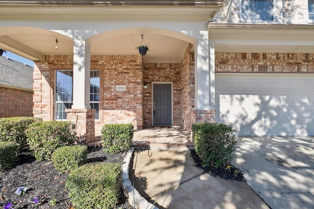 view of exterior entry featuring a garage