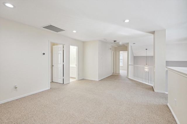 empty room with light colored carpet