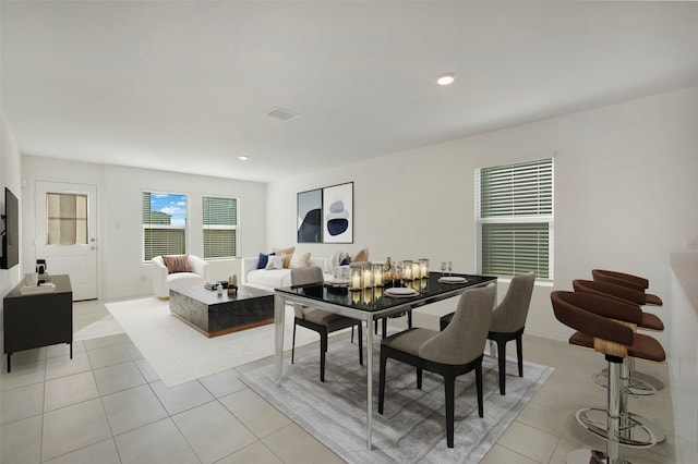 dining space with light tile patterned floors