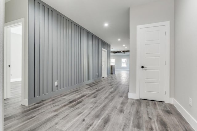 corridor with light wood-type flooring