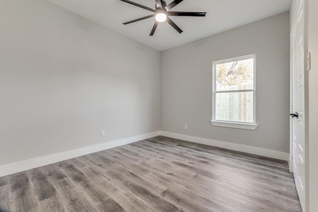 spare room with ceiling fan and light hardwood / wood-style flooring