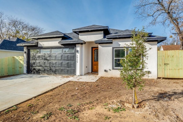 prairie-style house featuring a garage