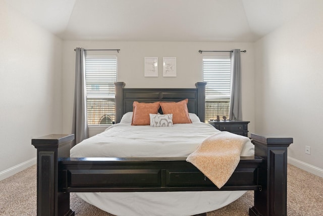 bedroom with lofted ceiling and carpet flooring