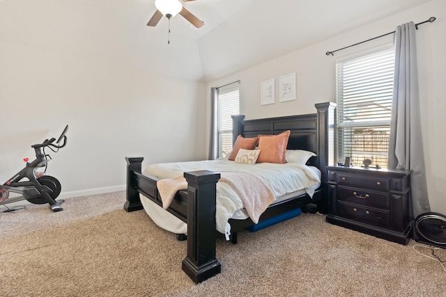 bedroom with lofted ceiling, ceiling fan, and carpet