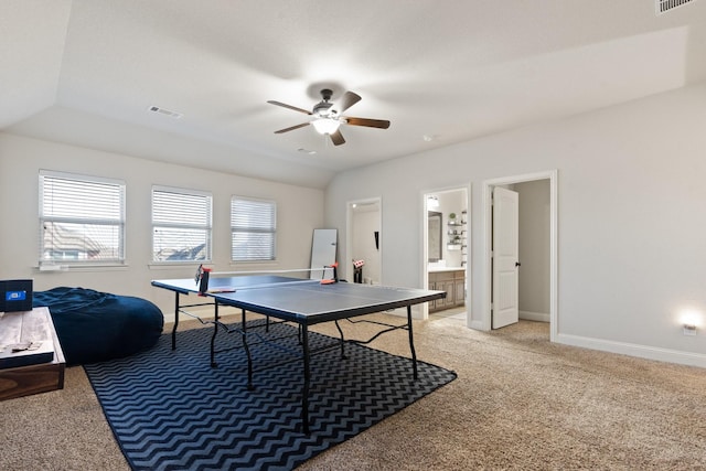 recreation room featuring vaulted ceiling, carpet, and ceiling fan