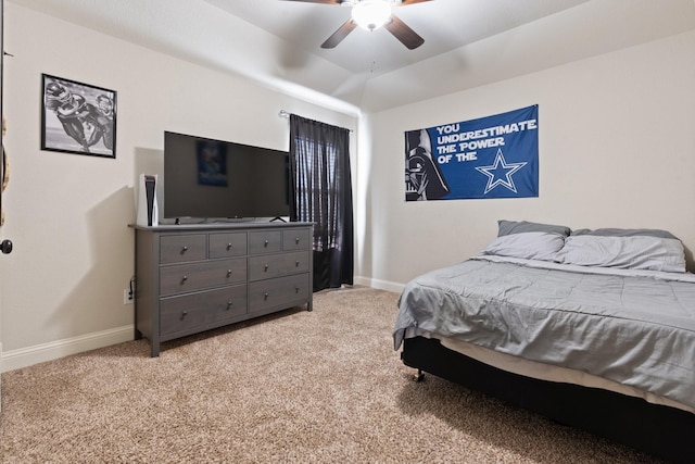 carpeted bedroom featuring lofted ceiling and ceiling fan