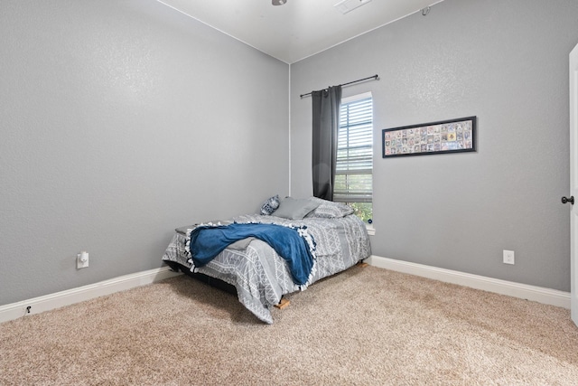 bedroom featuring carpet