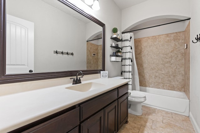 full bathroom with vanity, shower / bathtub combination with curtain, and toilet