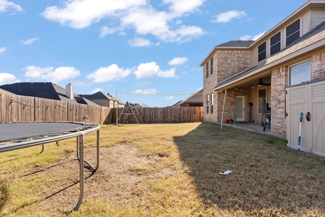 view of yard with a patio area and a trampoline