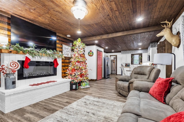 living room featuring beamed ceiling, wood-type flooring, wooden walls, and wood ceiling