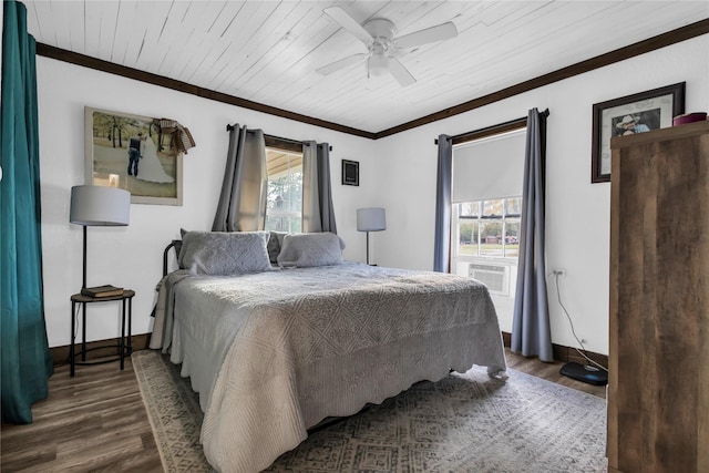 bedroom with ceiling fan, dark hardwood / wood-style flooring, wooden ceiling, and multiple windows