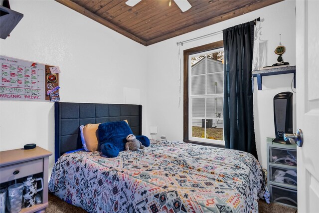 carpeted bedroom with ceiling fan, wooden ceiling, and ornamental molding