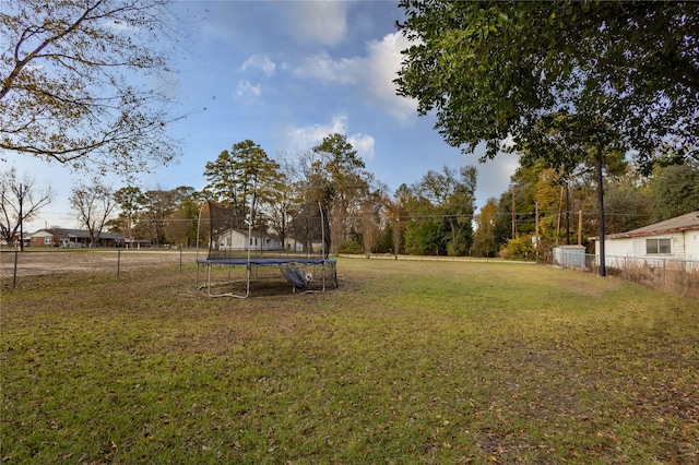 view of yard featuring a trampoline