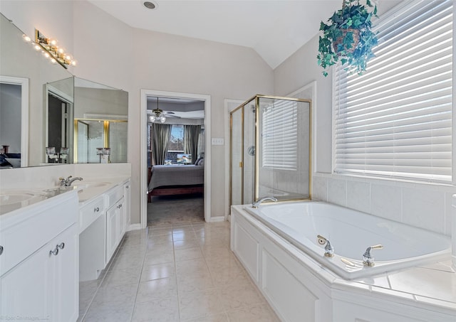 bathroom featuring vanity, vaulted ceiling, a wealth of natural light, and ceiling fan