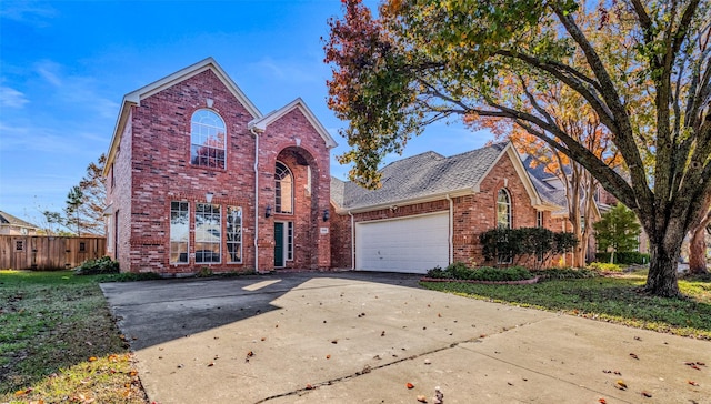 front facade featuring a front lawn and a garage