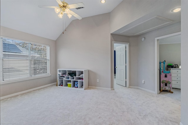 rec room with ceiling fan, light colored carpet, and lofted ceiling