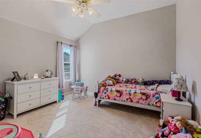 carpeted bedroom with vaulted ceiling and ceiling fan